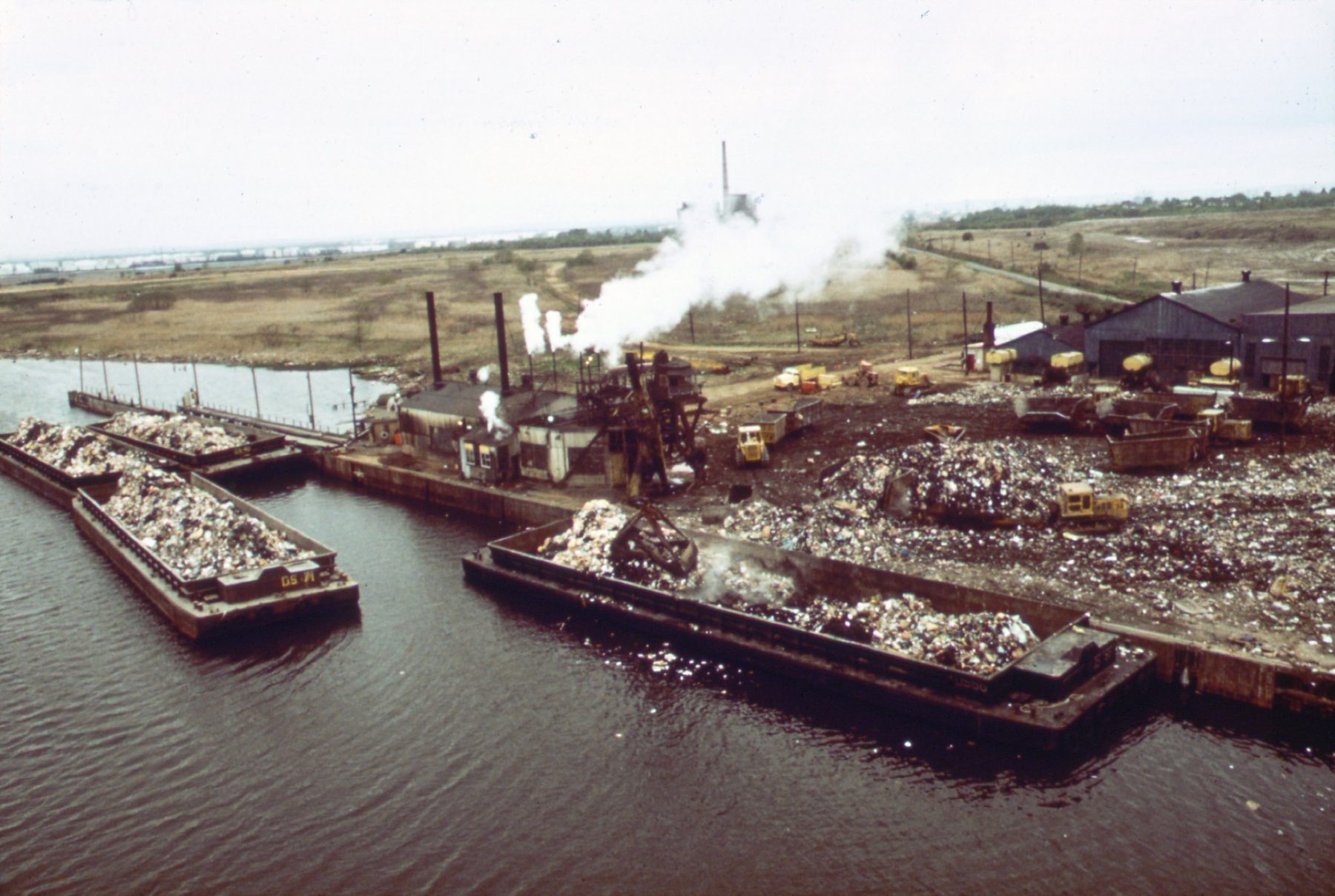 Fresh Kills in 1973: barges unloading at the landfill